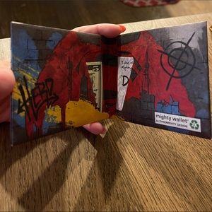 Superman mighty wallet. Wallet has a paper texture.